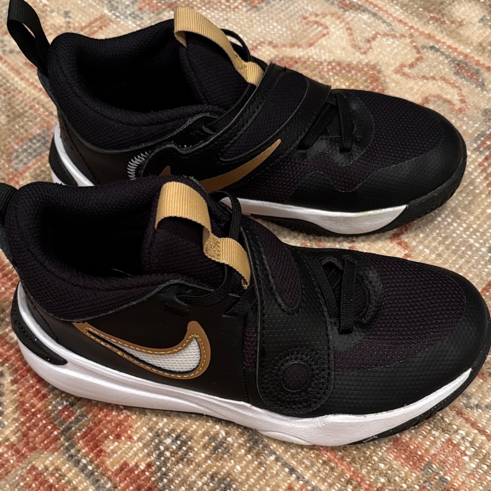 Nike Kids Black Sneakers with Gold Accents